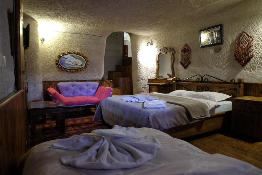 Postel nebo postele na pokoji v ubytování Anatolia cave hotel Pension
