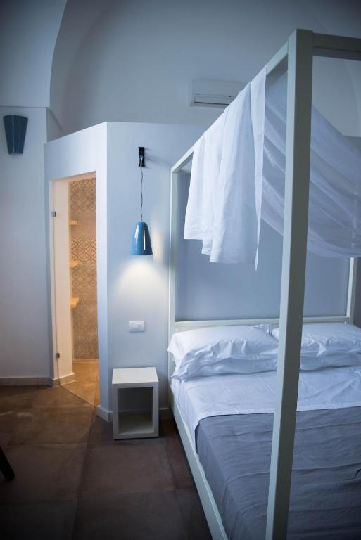 Postel nebo postele na pokoji v ubytování Dimora Del Duca, masseria b&b di charme