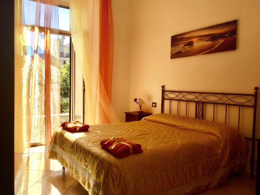 Postel nebo postele na pokoji v ubytování Aloha House
