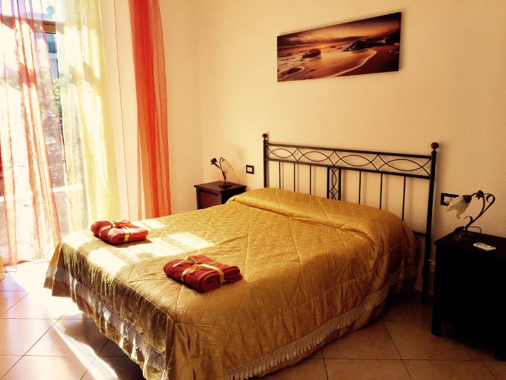 Postel nebo postele na pokoji v ubytování Aloha House