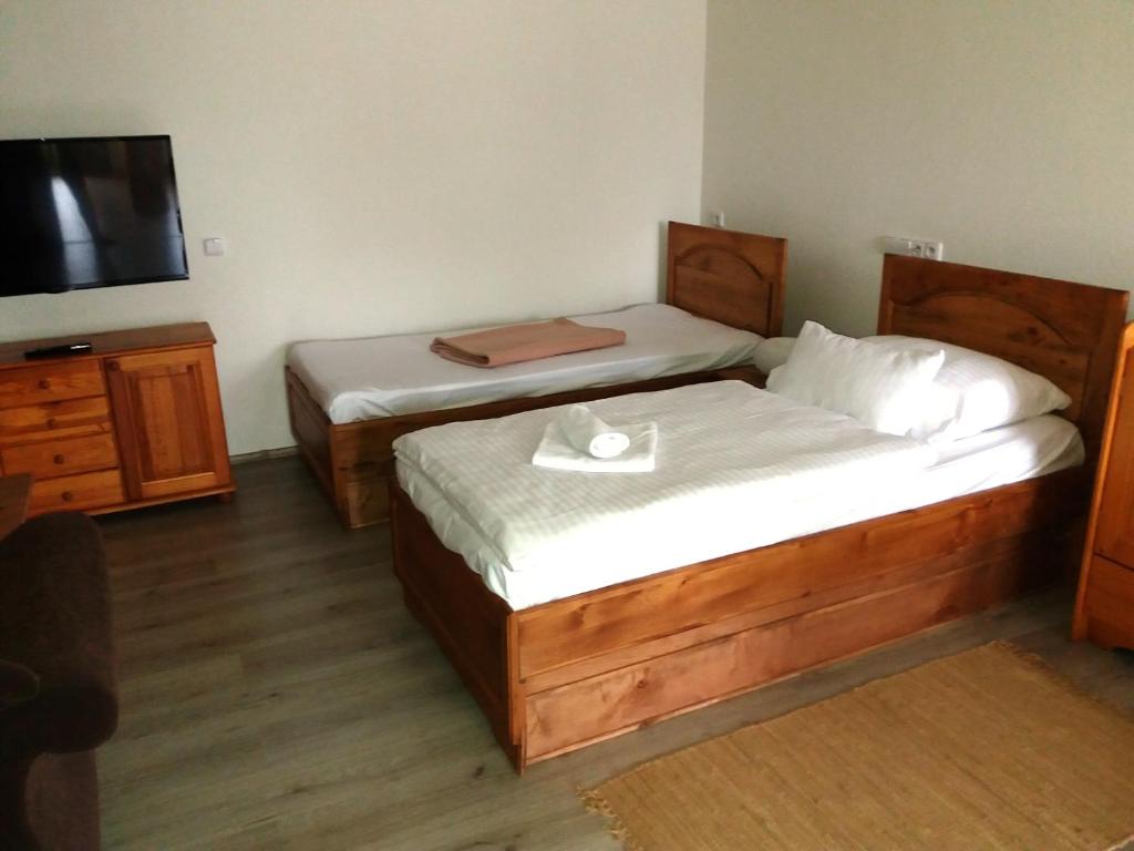 Postel nebo postele na pokoji v ubytování Hotel Na Šustně