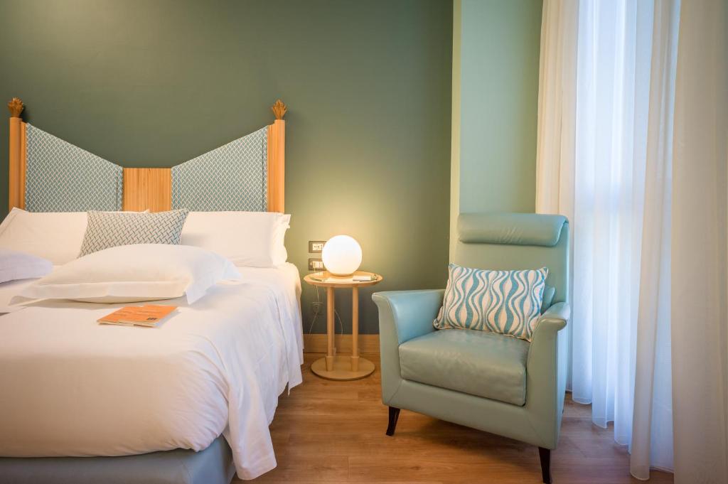 Postel nebo postele na pokoji v ubytování Hotel Spadari Al Duomo