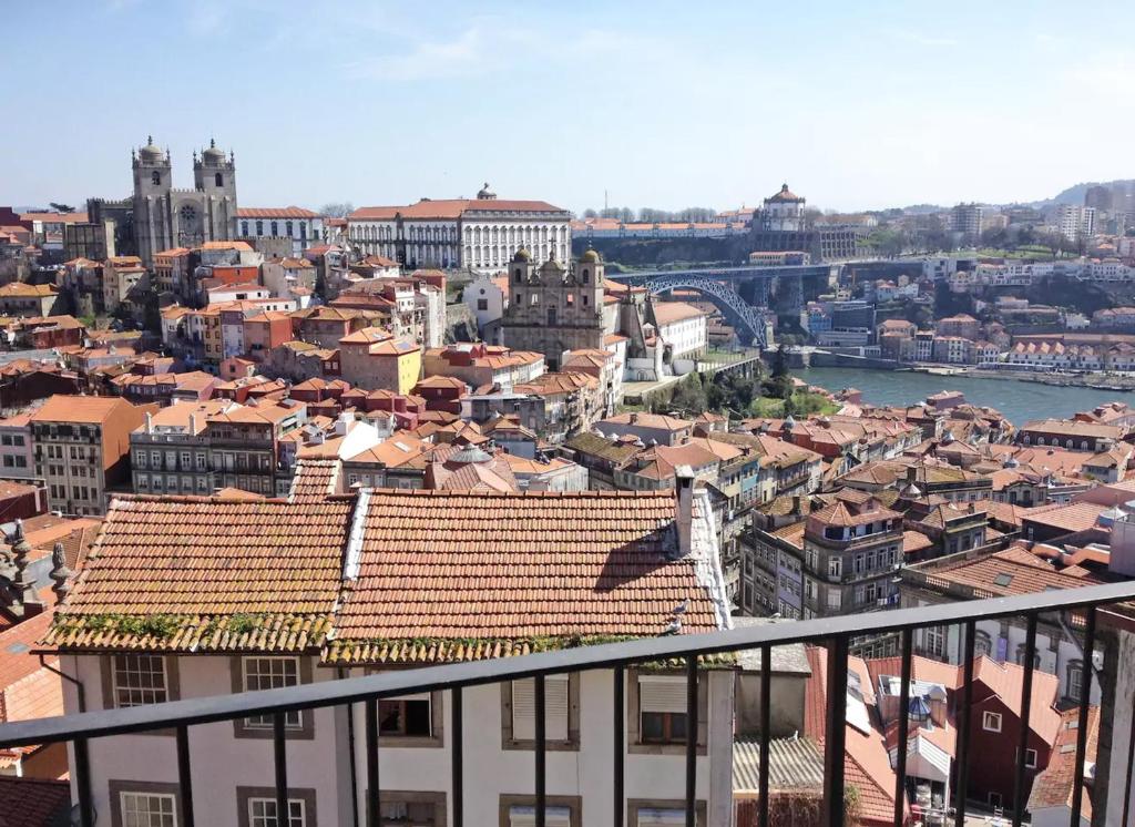 a view of a city with a river and buildings at Boutique Rentals - Hidden Treasure in Porto