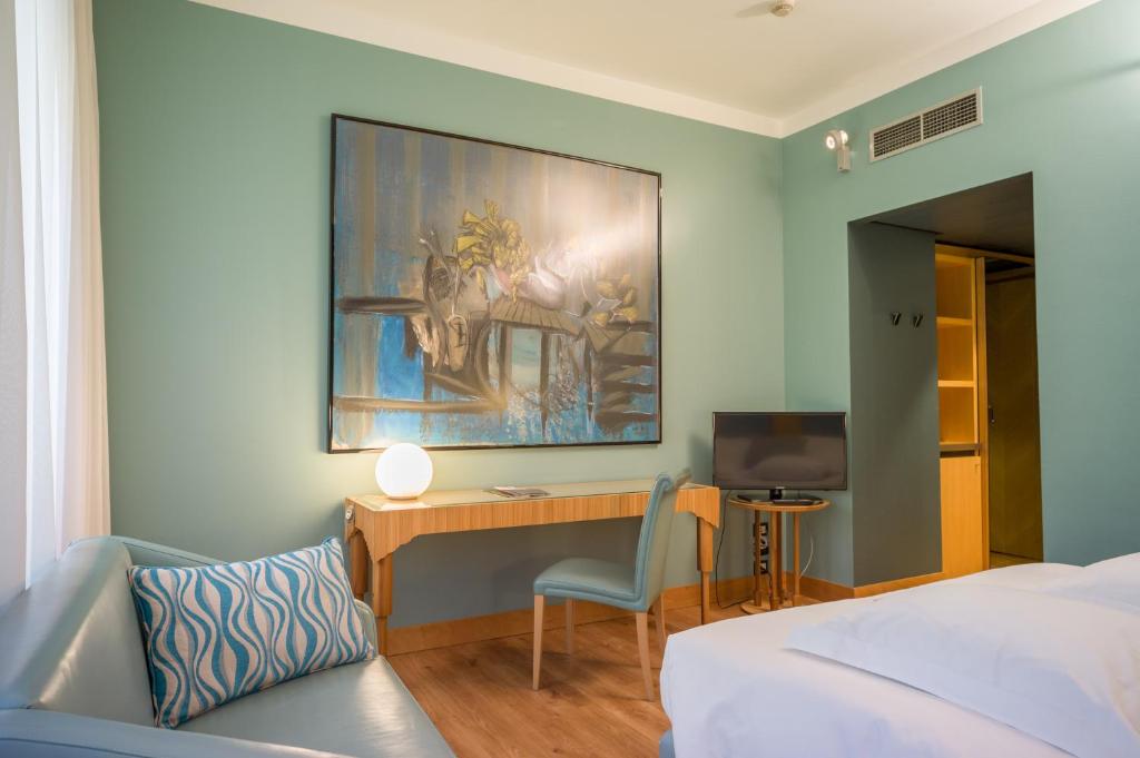 Postel nebo postele na pokoji v ubytování Hotel Spadari Al Duomo