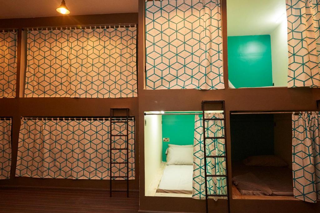 a room with a bed and some glass doors at Lost & Found Zanzibar in Zanzibar City