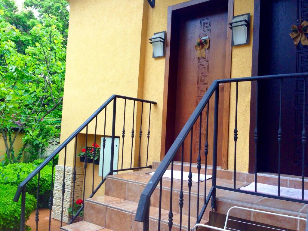 a front door of a house with stairs at Guest Rooms Boutique Varna in Varna City