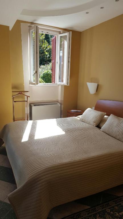 Postel nebo postele na pokoji v ubytování Albergo Del Lago