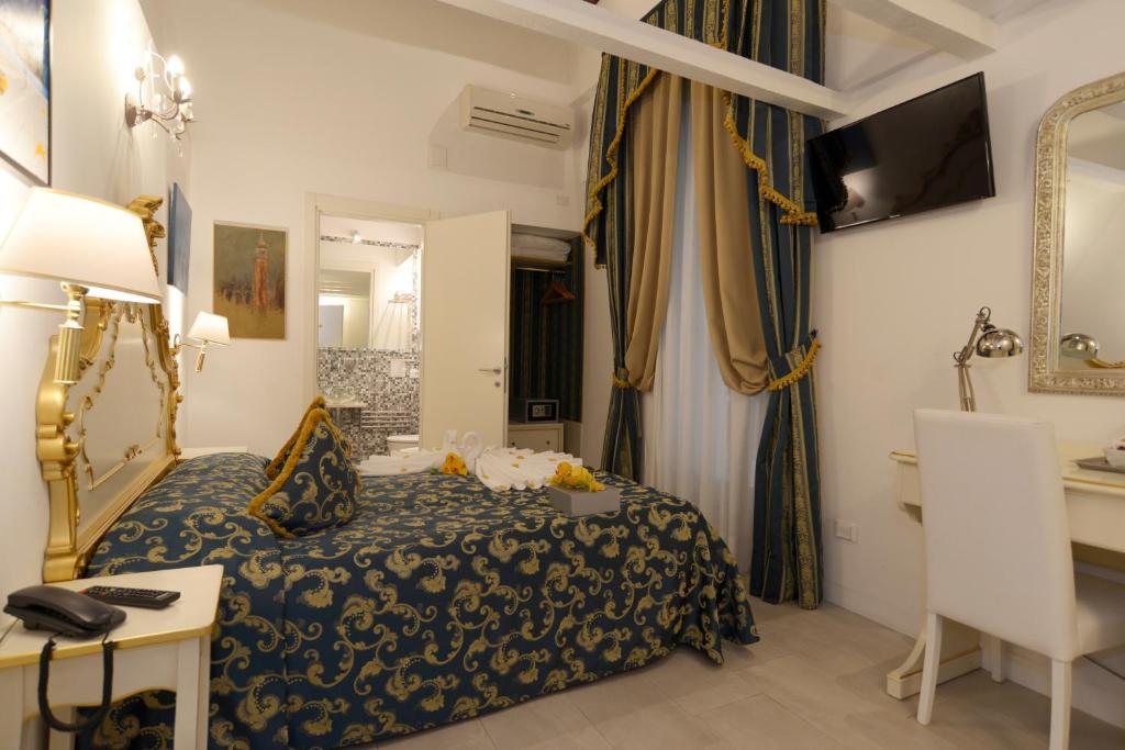 Cama ou camas em um quarto em Al Mascaron Ridente