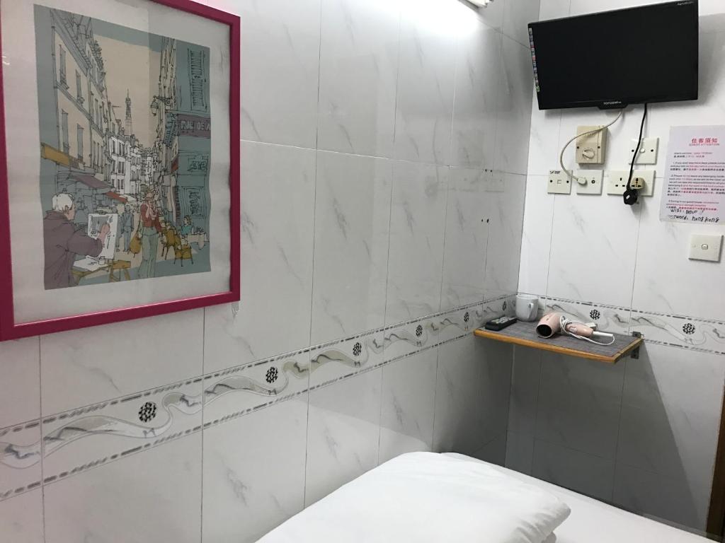 Postel nebo postele na pokoji v ubytování Beverly Guest House