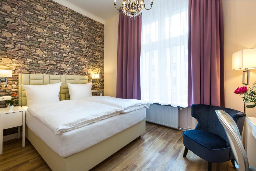 Postel nebo postele na pokoji v ubytování AMC Hotel - Schöneberg