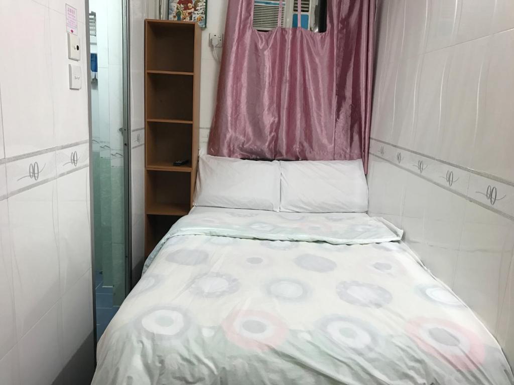 Postel nebo postele na pokoji v ubytování Beverly Guest House