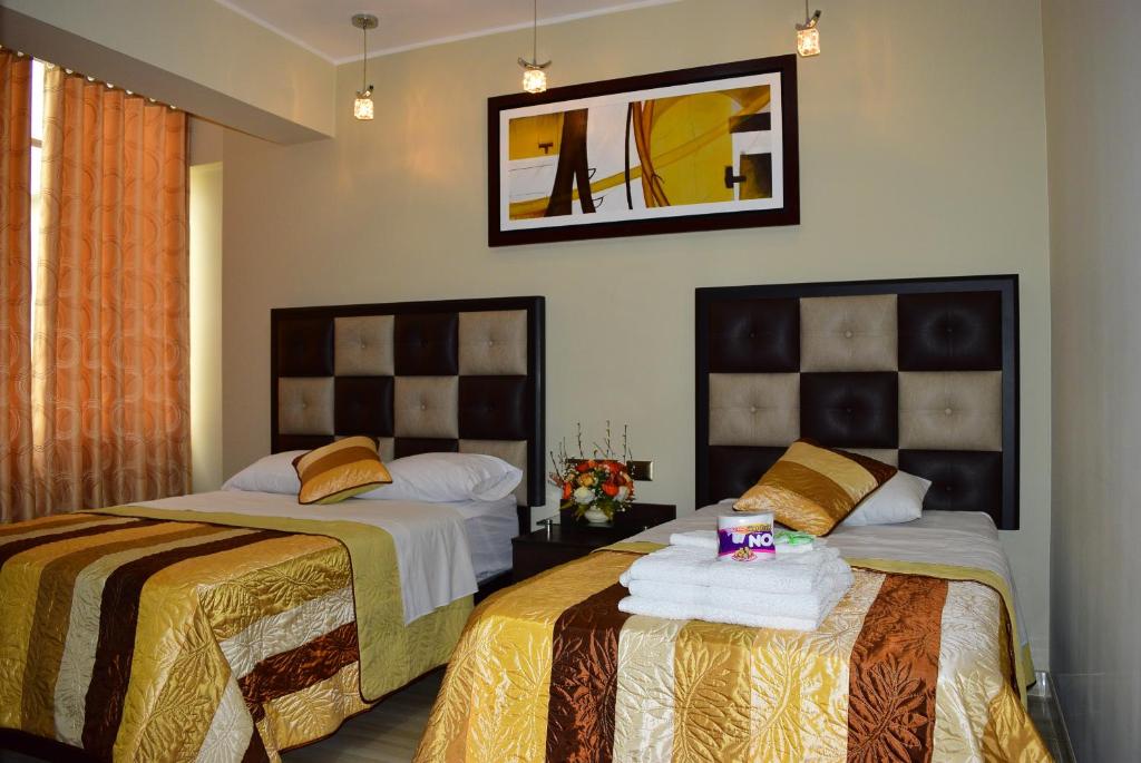 Postel nebo postele na pokoji v ubytování Hostal Gold Star