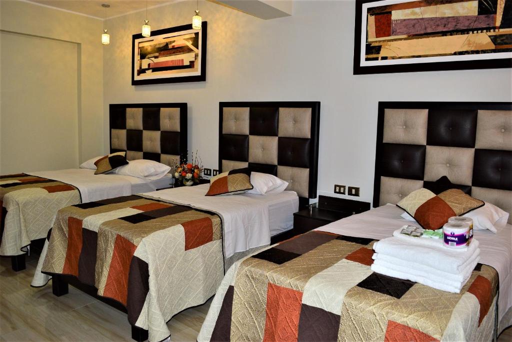 Postel nebo postele na pokoji v ubytování Hostal Gold Star