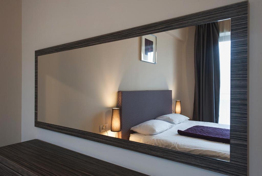 Postel nebo postele na pokoji v ubytování Hotel Hemingway Residence