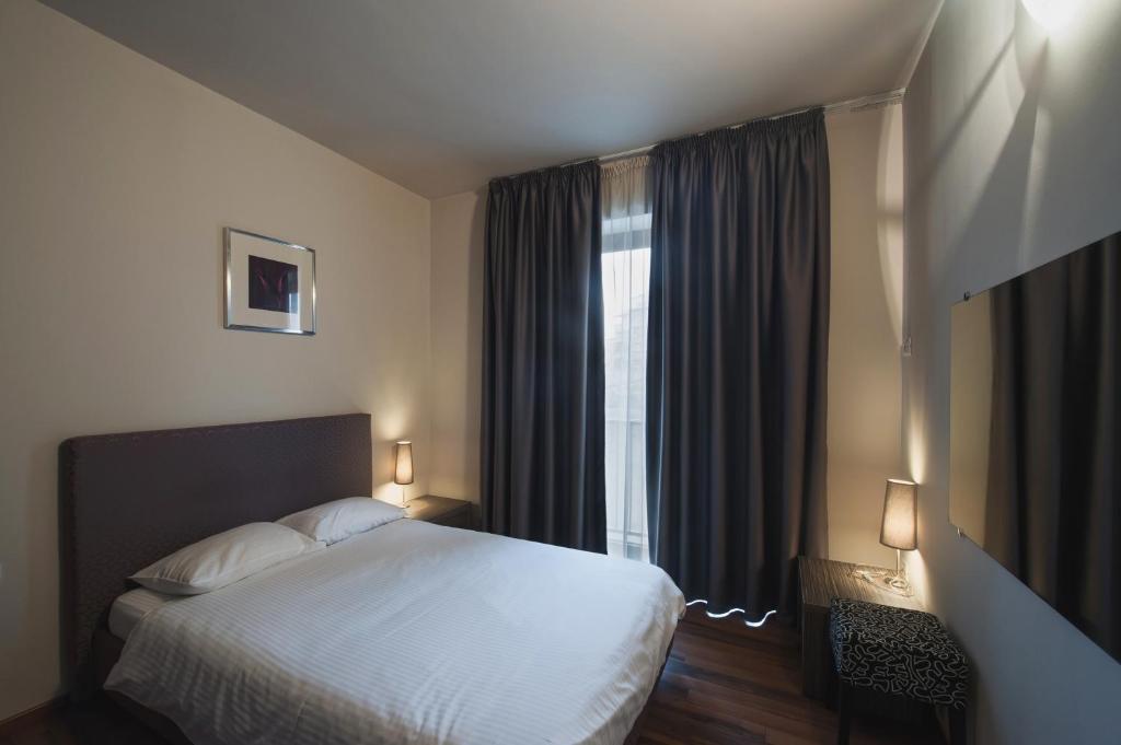 Postel nebo postele na pokoji v ubytování Hotel Hemingway Residence