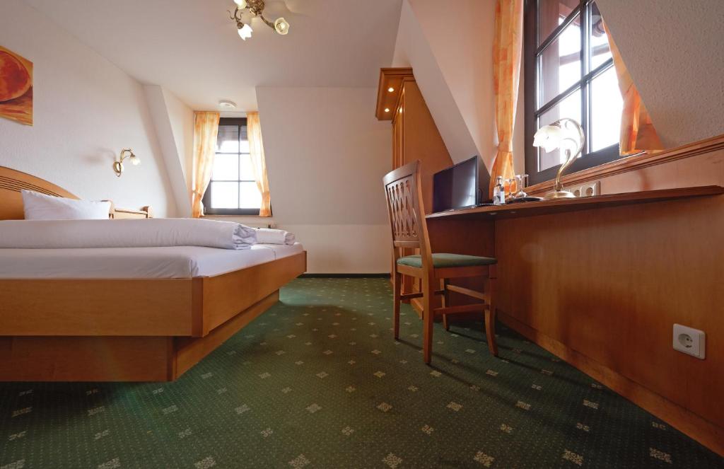 Postel nebo postele na pokoji v ubytování Hotel Ochsen