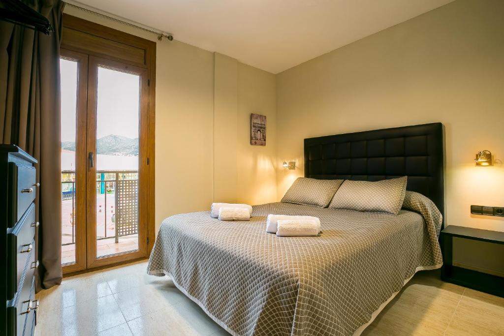 Postel nebo postele na pokoji v ubytování Hotel Montmar