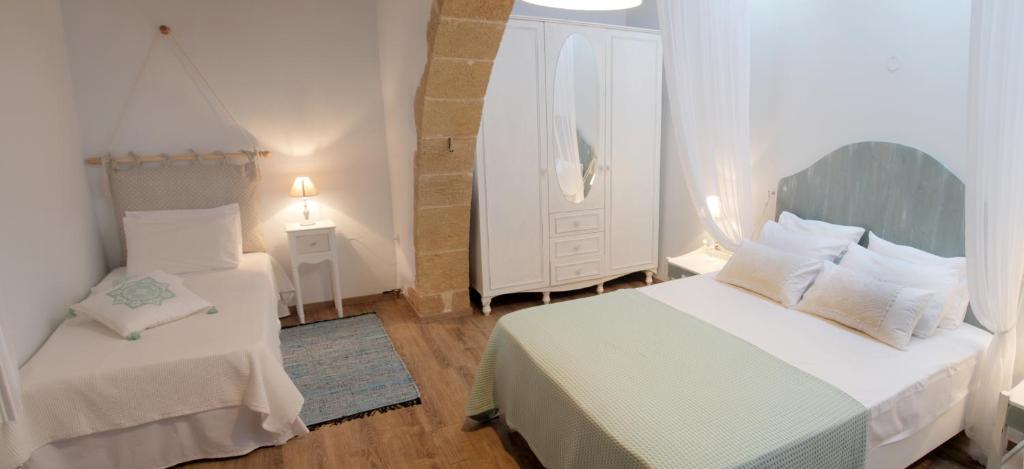Postel nebo postele na pokoji v ubytování Villa Meli-milon