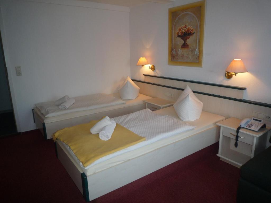 Postel nebo postele na pokoji v ubytování Hotel Schnehagen
