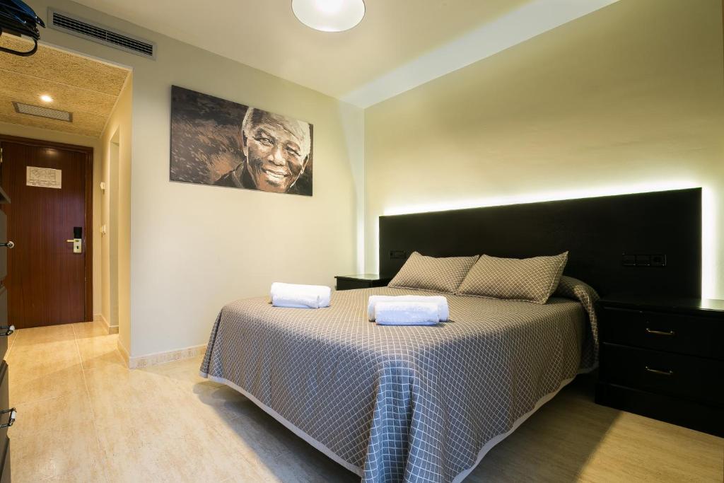 Postel nebo postele na pokoji v ubytování Hotel Montmar