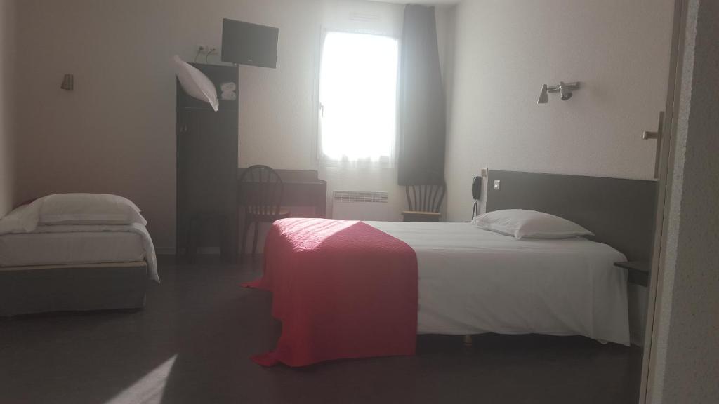 Postel nebo postele na pokoji v ubytování Relax Hotel