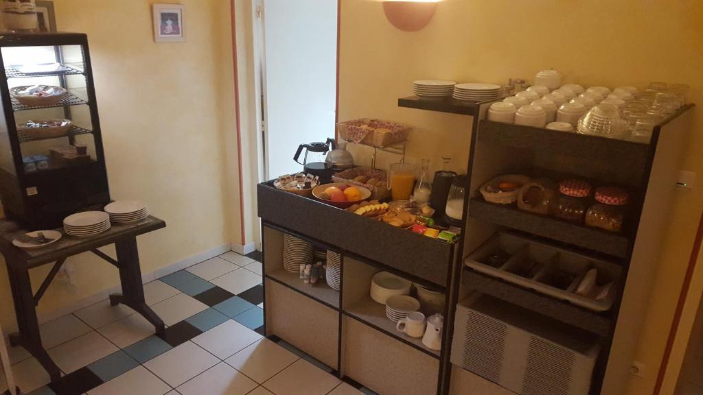 Kuchyň nebo kuchyňský kout v ubytování Relax Hotel