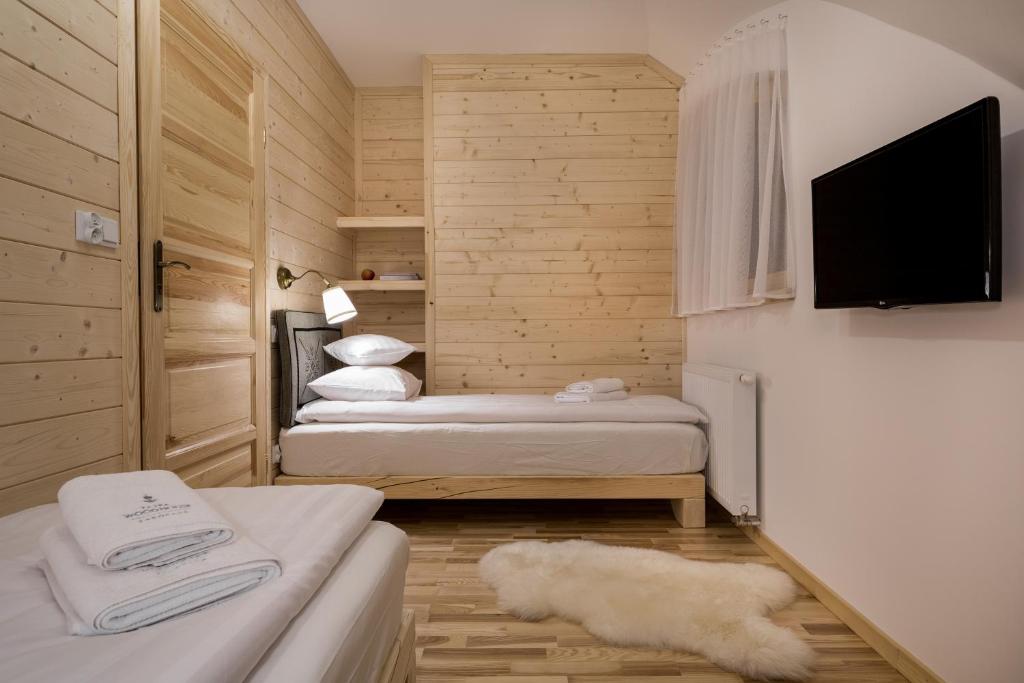 Posteľ alebo postele v izbe v ubytovaní Tatra Wood House