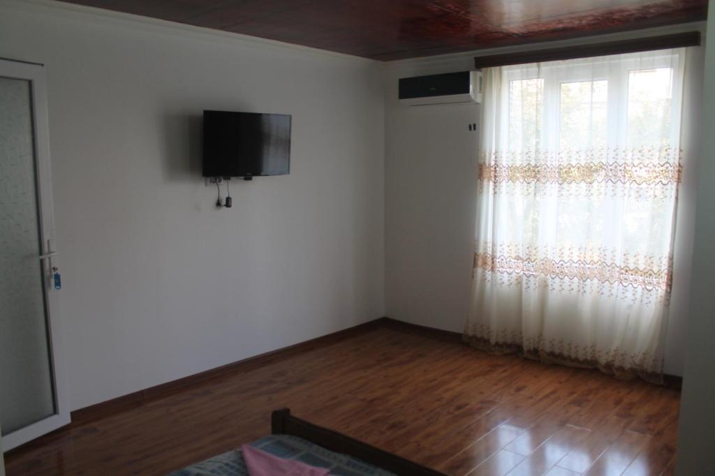 TV a/nebo společenská místnost v ubytování Guest House Maxim