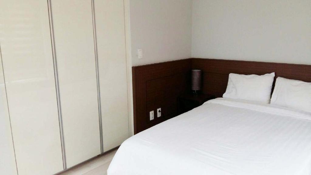 Postel nebo postele na pokoji v ubytování Gaon Residence Hotel