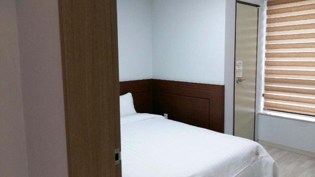 Postel nebo postele na pokoji v ubytování Gaon Residence Hotel