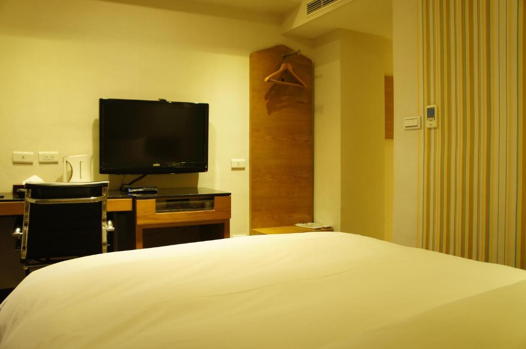 TV a/nebo společenská místnost v ubytování Country Garden Hotel
