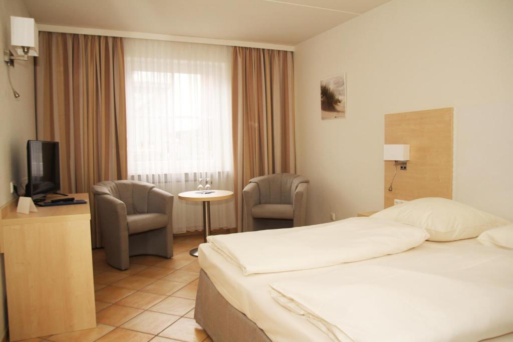 Postel nebo postele na pokoji v ubytování Hotel Deutscher Kaiser