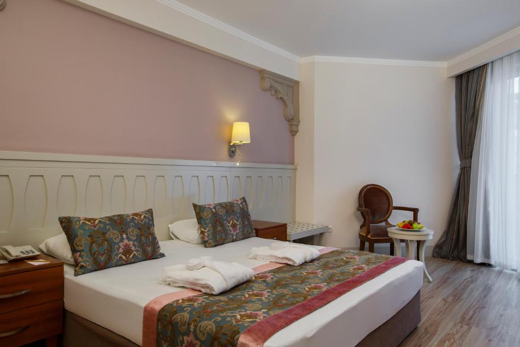 Postel nebo postele na pokoji v ubytování Side Crown Serenity Ultra All Inclusive