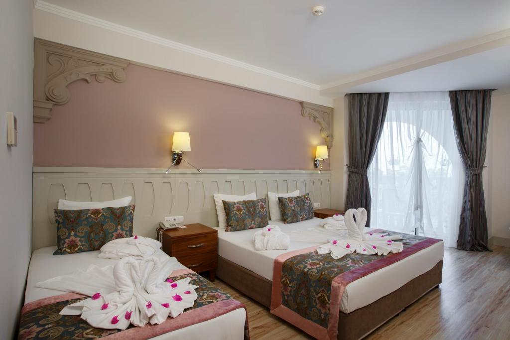 Postel nebo postele na pokoji v ubytování Side Crown Serenity Ultra All Inclusive