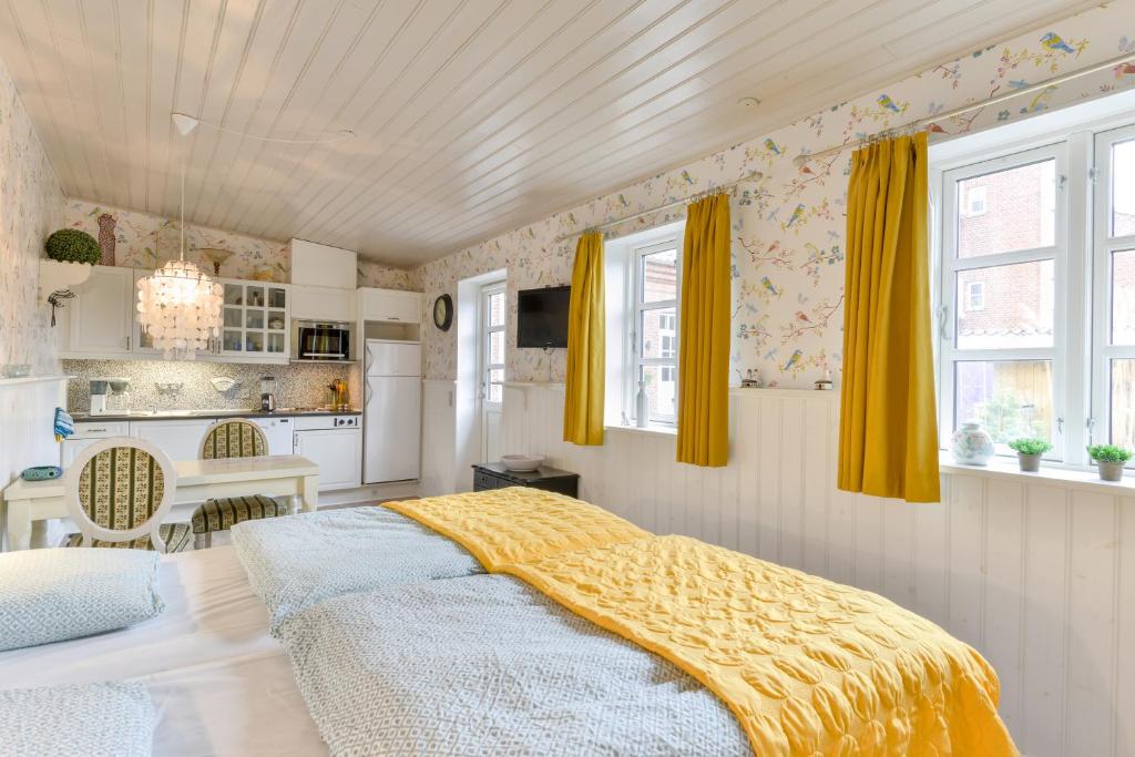 Postel nebo postele na pokoji v ubytování Viborg City Rooms