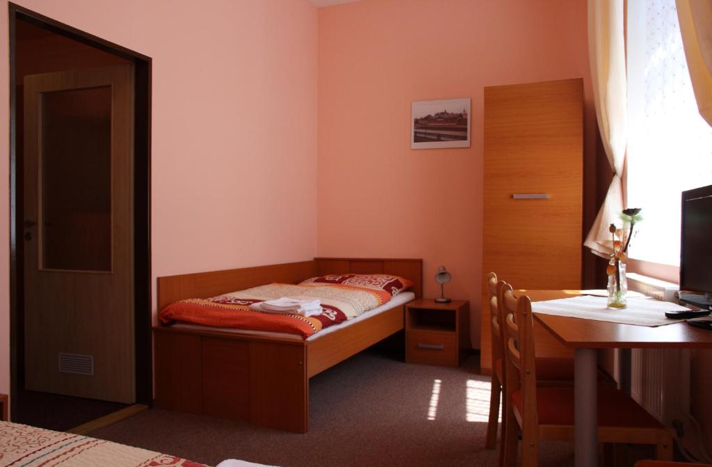 Postel nebo postele na pokoji v ubytování Penzion Česká Koruna