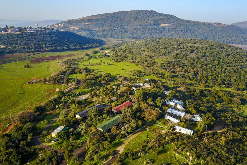 an aerial view of a farm in a field at Kibbutz Inbar Country Lodging in Kibbutz Inbar