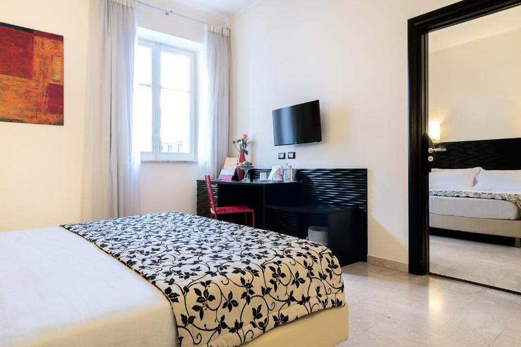 Cama o camas de una habitación en Hotel Garibaldi