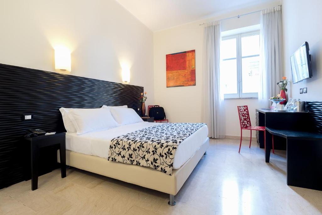 Cama o camas de una habitación en Hotel Garibaldi