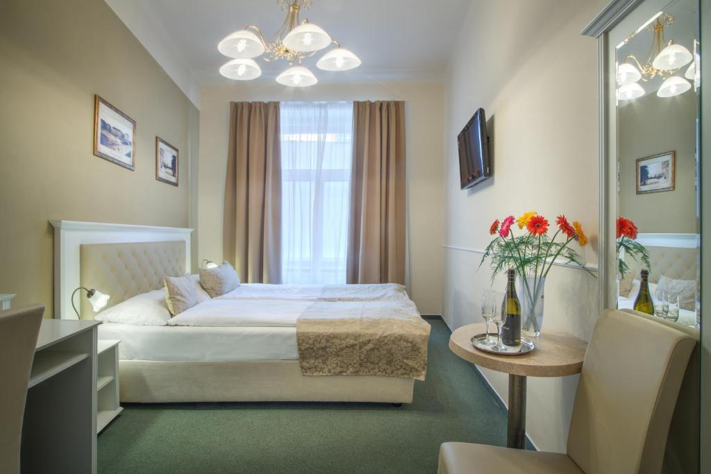 Postel nebo postele na pokoji v ubytování Hotel Taurus