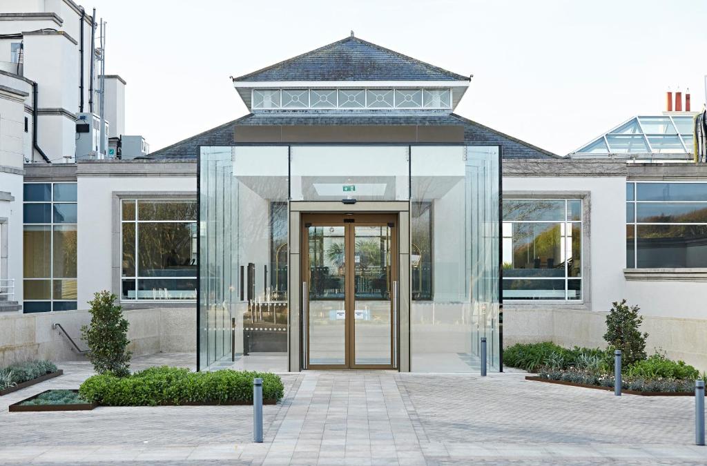a glass entrance to a building with a glass door at Portmarnock Resort & Jameson Golf Links in Portmarnock
