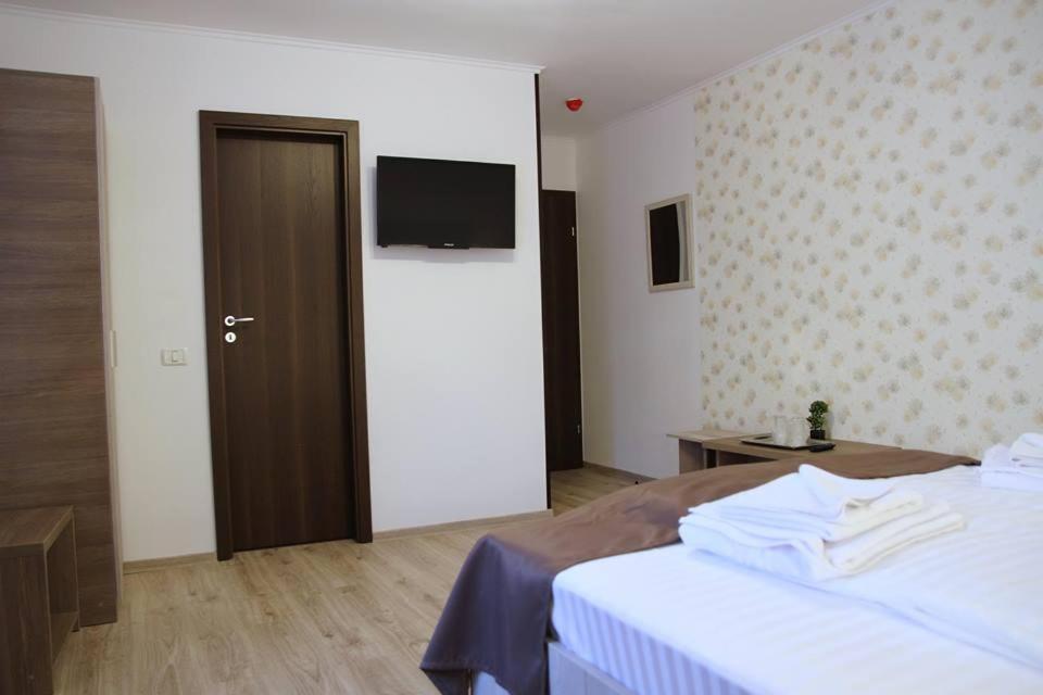 Postel nebo postele na pokoji v ubytování Pensiunea Argesu **