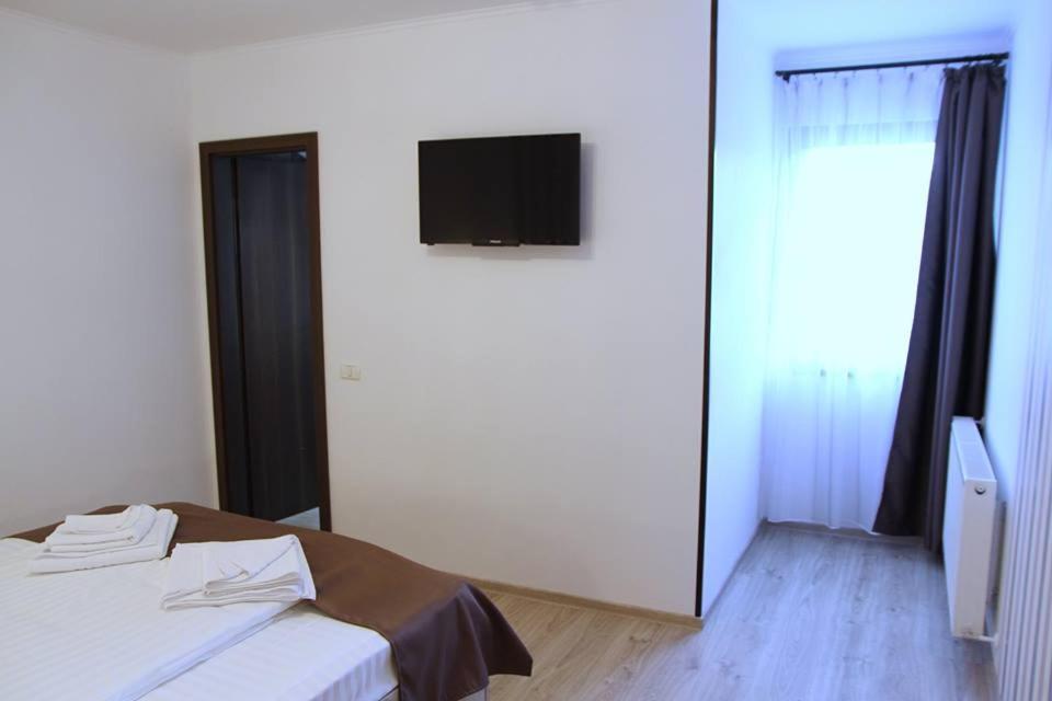 Postel nebo postele na pokoji v ubytování Pensiunea Argesu **