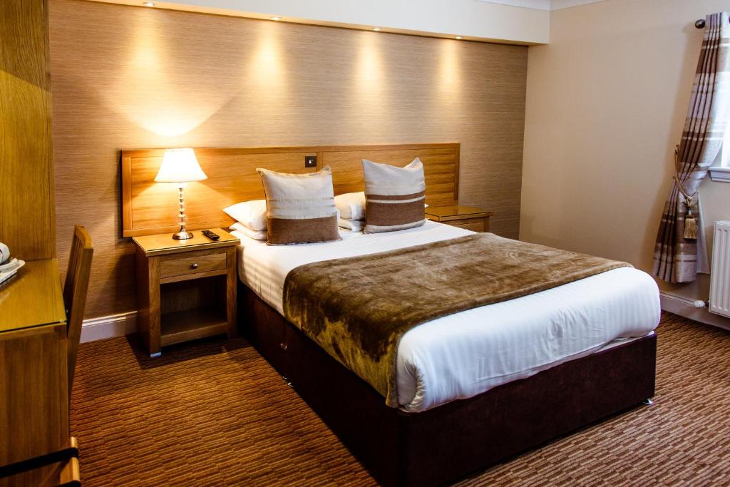 Postel nebo postele na pokoji v ubytování Adamson Hotel