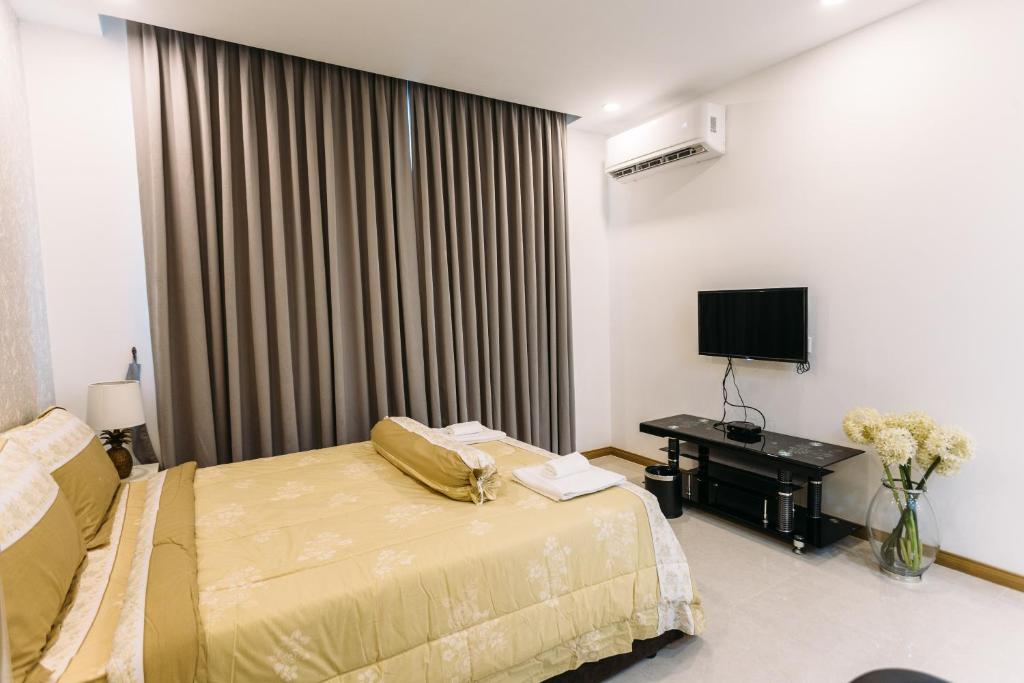 Postel nebo postele na pokoji v ubytování CA&SA Serviced Apartment