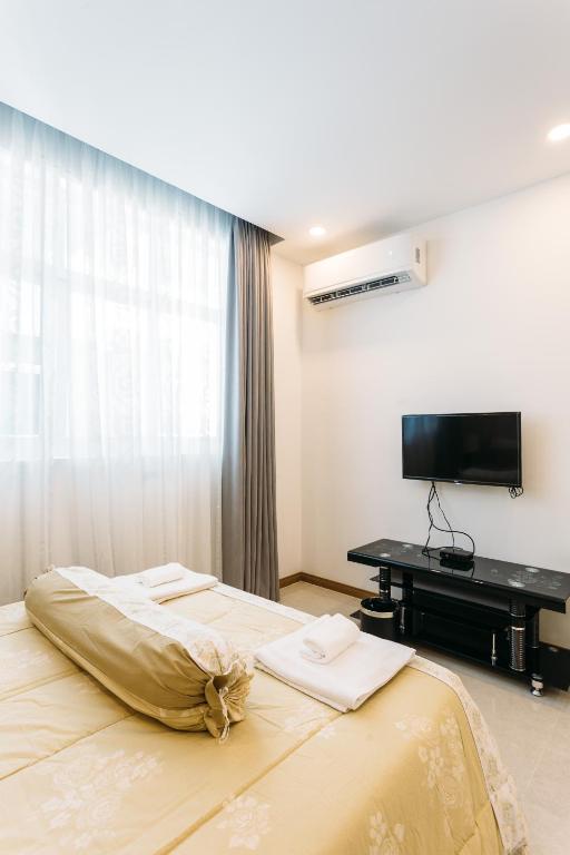 Postel nebo postele na pokoji v ubytování CA&SA Serviced Apartment