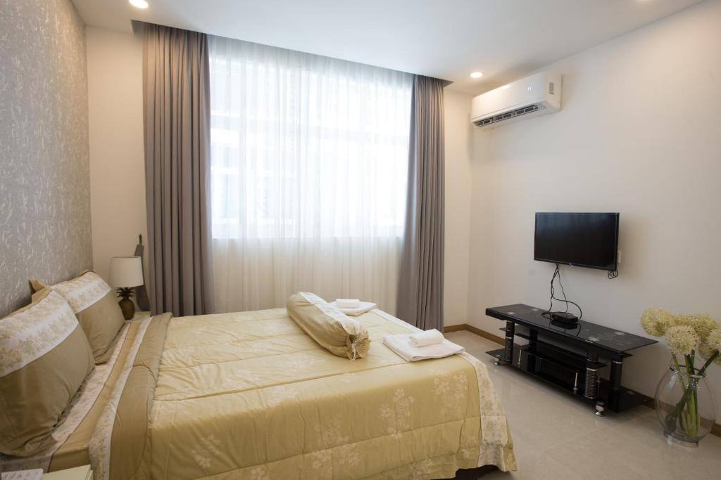 Postel nebo postele na pokoji v ubytování CA&SA Serviced Apartment