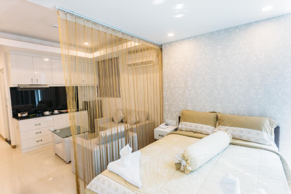 Postel nebo postele na pokoji v ubytování CA&SA Serviced Apartment