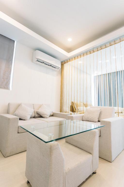 Posezení v ubytování CA&SA Serviced Apartment