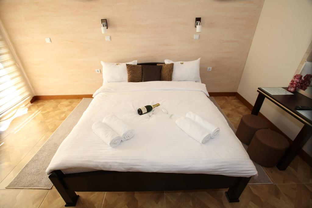 Postel nebo postele na pokoji v ubytování Cuki Residence